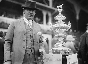 A man holding the Woodlawn Vase trophy